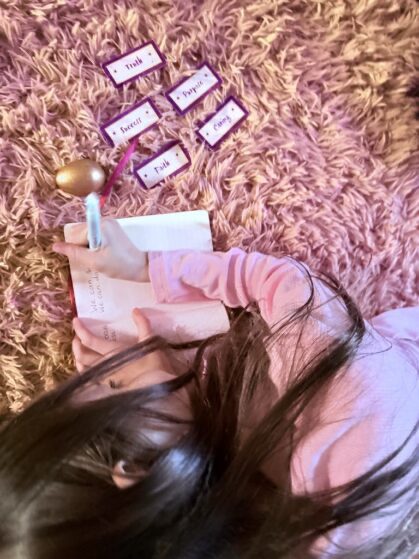 A girl lying on the floor, writing lyrics