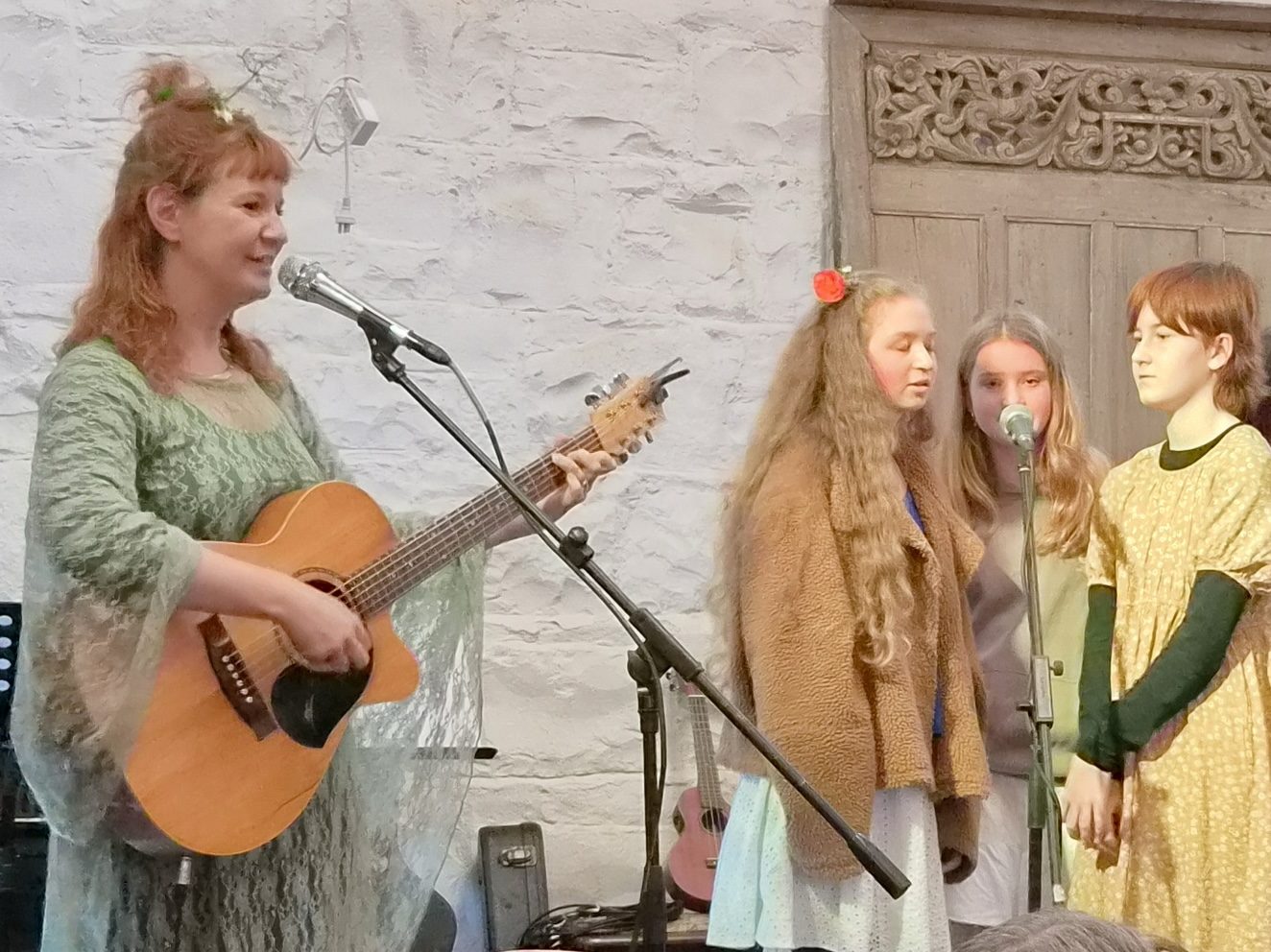 Girls singing together in a small group with Melody